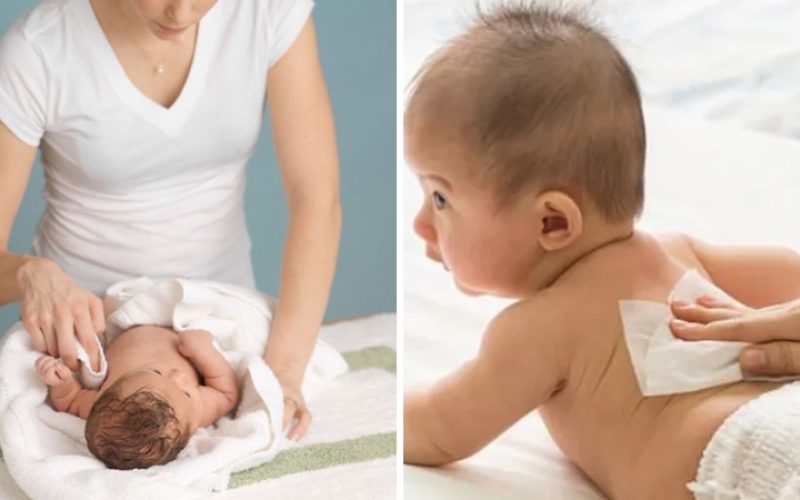 ảnh mẹ dùng khăn vải khô lau tay cho bé sơ sinh